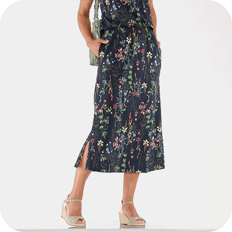 Woman wearing floral print Jersey Midi Skirt.