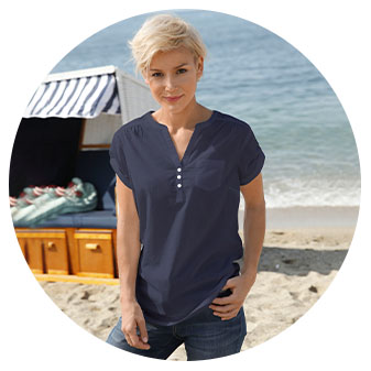 Women wearing the V-Neck Button Panel Blouse in the Navy color.