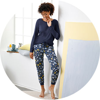 Woman wearing the dark blue-printed pajama pant.