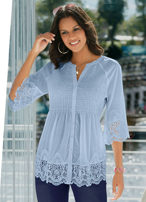 Woman wearing the light blue full length button panel lacy blouse.