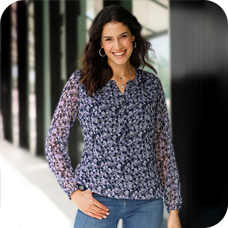 Woman wearing Long Sleeve Floral Blouse.