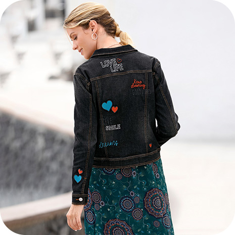 Woman wearing Embroidered Denim Jacket.