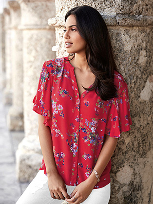 Woman wearing a floral blouse.