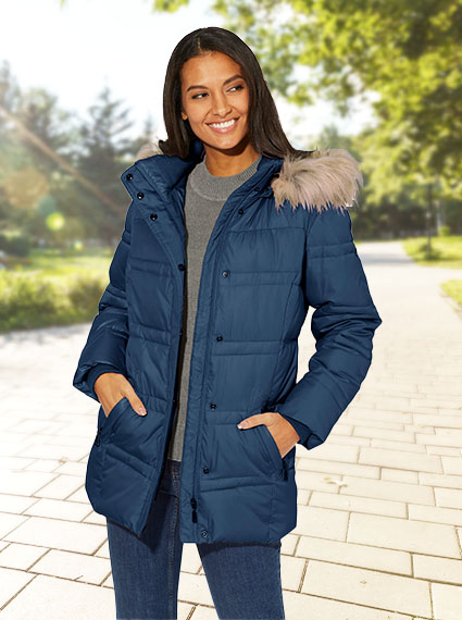 Woman wearing the dark blue quilted faux fur trim jacket.