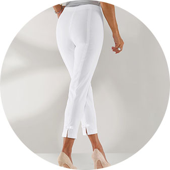 Woman wearing the white slip on capri pants.
