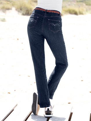 Women wearing the blue-stone-washed back pocket detail jeans.